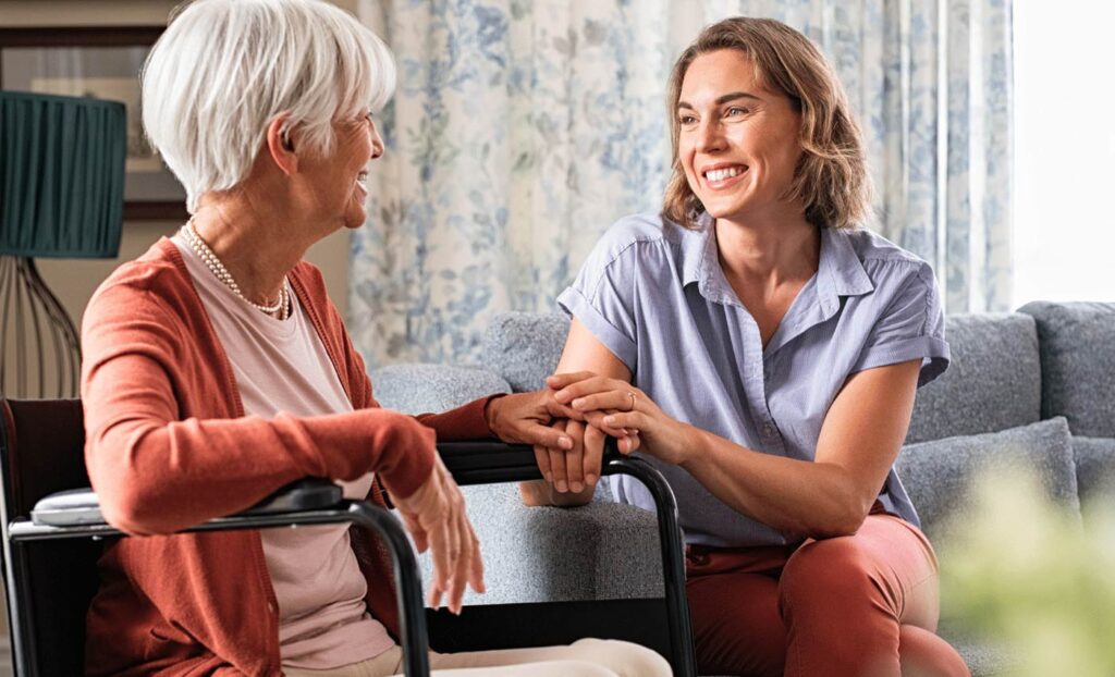 Caregiver Support - elderly patient with a friendly caregiver