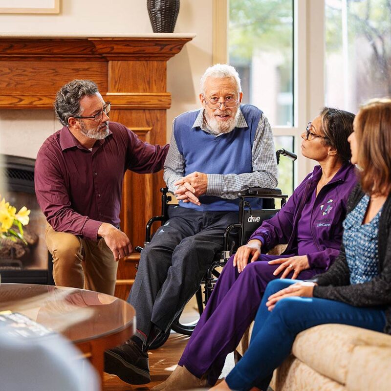 a hospice nursing helping a patient at Transitions LifeCare