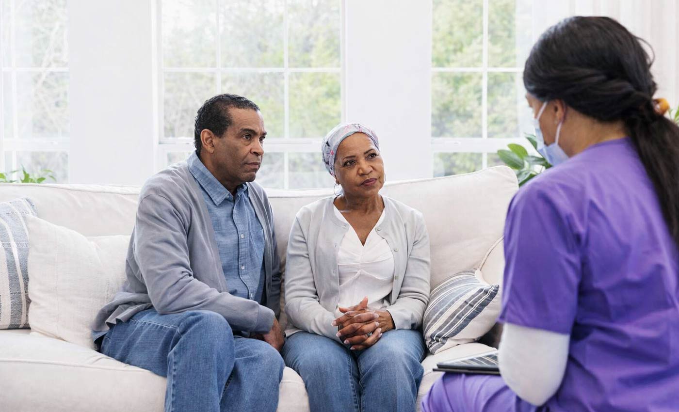 hospice nurse talking with patients at Transitions LifeCare